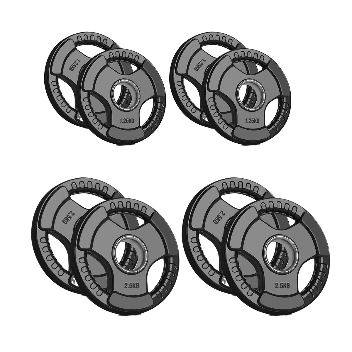 Set of four weight plates with different weights on a white background