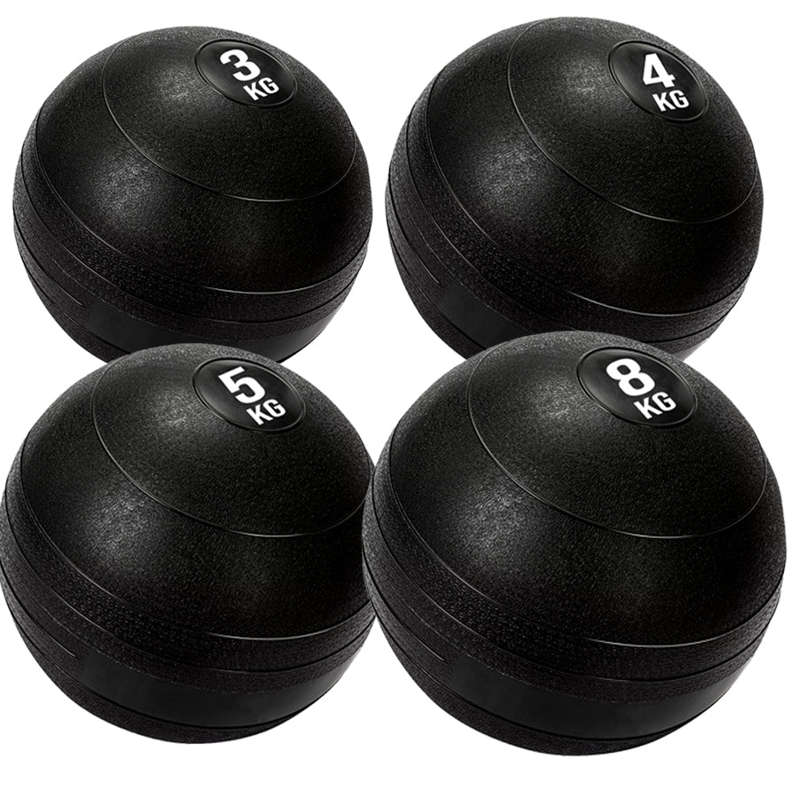 4 black heavy duty slam balls with a textured surface and the white background
