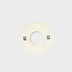 White weight plate with '0.5 KG' marking on a light gray background