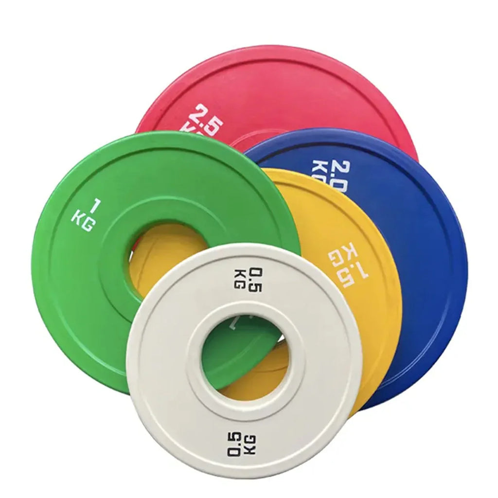 Colorful weightlifting plates on a white background