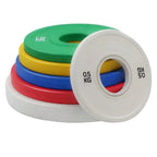 Set of colorful weight plates with a white base on a white background